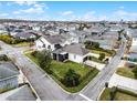 Two-story house, aerial view, showing backyard and neighborhood at 9133 Smithies St, Orlando, FL 32827