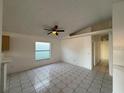 Spacious living room featuring tile floors and a ceiling fan at 147 Dahlia Village Cir # Ge, Orlando, FL 32807
