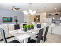 Modern dining room with white table and black chairs at 5149 Adelaide Dr, Kissimmee, FL 34746