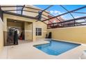 Private screened-in pool with a patio area, perfect for outdoor relaxation and entertaining at 8939 Bismarck Palm Rd, Kissimmee, FL 34747