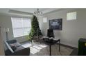 Spacious home office with a large desk and comfortable seating at 9271 Patrimonio Loop, Windermere, FL 34786