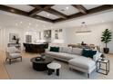 Open-concept living space with elegant decor, flowing into a modern kitchen and dining area at 10214 Chiltern Garden Dr, Orlando, FL 32827
