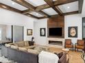 Living room features a modern fireplace and large sliding doors at 10214 Chiltern Garden Dr, Orlando, FL 32827