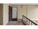 Condo entryway featuring unit door with a secure metal grate door and the unit letter 'H' on the white main door at 314 Cherokee Ct # H, Altamonte Springs, FL 32701