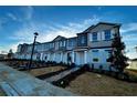 New townhome community featuring modern two-story homes with landscaping at 592 Pothos St, Apopka, FL 32703