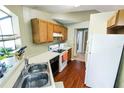 Cozy kitchen with wood cabinets and modern appliances at 704 Monroe Harbor Pl, Sanford, FL 32773