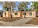 Charming single-story home with a well-maintained lawn and a classic stucco exterior at 2341 Hadley St, Deltona, FL 32738