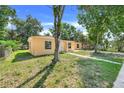 Single-story home with lawn, trees, and a walkway leading to the front door at 2341 Hadley St, Deltona, FL 32738