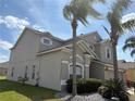 Beautiful, two story home with a two car garage, lush landscaping, and gorgeous mature palm trees at 2510 Black Lake Blvd, Winter Garden, FL 34787