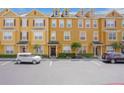 Charming three-story townhome with neat landscaping, a welcoming front door, and convenient parking at 607 Pensacola Ln, Lake Mary, FL 32746