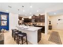 Modern kitchen with stainless steel appliances and an island at 8851 Geneve Ct, Kissimmee, FL 34747
