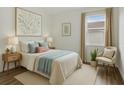 Stylishly decorated bedroom featuring calming colors, natural light, and tasteful furnishings at 2829 Shelburne Way, St Cloud, FL 34772