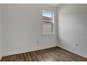 This bedroom offers wood flooring and a bright window, great for natural light at 2829 Shelburne Way, St Cloud, FL 34772