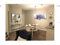 Bright dining area with table and chairs at 8817 Dunes Ct # 203, Kissimmee, FL 34747