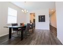 Bright dining room with a modern table and chairs at 1516 Grassland Ave, Saint Cloud, FL 34771