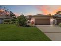Charming single-story home featuring a well-manicured lawn and an attached garage at 7 Huntley Ct., Haines City, FL 33844