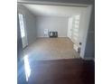 Bright living room featuring neutral walls, tile flooring, and built-in shelving for storage at 116 Main St, Windermere, FL 34786