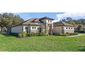 House exterior showcasing stone and tile roof at 25859 Crossings Bluff Ln, Sorrento, FL 32776