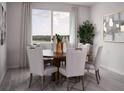 Elegant dining room with a round table and six chairs at 2332 Citrus Bloom Dr, Bartow, FL 33830