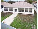 Single-story home with a large sunroom and fenced backyard at 2485 Huron Cir, Kissimmee, FL 34746