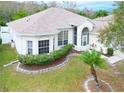 Single-story house with a landscaped yard and a curved driveway at 2485 Huron Cir, Kissimmee, FL 34746