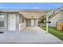 Covered carport with concrete parking area at 842 E Church Ave, Longwood, FL 32750