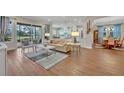 Open living space with hardwood floors and view of backyard at 14157 Creekbed Cir, Winter Garden, FL 34787