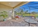 Screened patio with pavers and seating area at 14157 Creekbed Cir, Winter Garden, FL 34787