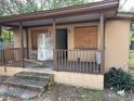 A fixer-upper home with a covered porch needing renovations at 3108 Lawrence St, Orlando, FL 32805