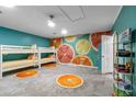 ' bedroom with bunk beds and citrus mural at 3151 Riachuelo Ln, Kissimmee, FL 34744
