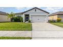 Single-story home with attached garage and well-manicured lawn at 538 Stowers Dr, New Smyrna Beach, FL 32168