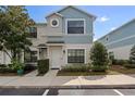 Charming two-story townhome featuring a well-manicured lawn and a welcoming front entrance at 1161 Trillium Park Ln, Sanford, FL 32773