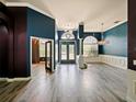 Spacious living room with hardwood floors and blue and purple walls at 1424 Richmond Grand Ave, Orlando, FL 32820