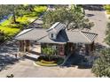 Elegant community entrance featuring stone accents, manicured landscaping, and a welcoming gate at 1446 Foxtail Ct, Lake Mary, FL 32746