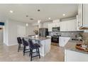 Bright kitchen with stainless steel appliances and granite countertops at 1656 Aspen Ave, Davenport, FL 33837