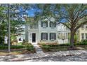 Two-story home with a covered balcony and beautiful landscaping at 3929 Corrine Dr, Orlando, FL 32814
