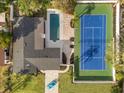 Birds eye view of a single Gathering home with a pool and private tennis court at 2337 Worthington Rd, Maitland, FL 32751