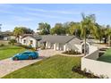 Charming single story home boasting a three-car garage, manicured lawn, and beautifully paved driveway at 2337 Worthington Rd, Maitland, FL 32751
