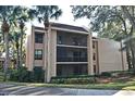 Tan condo building with screened balconies at 610 Cranes Way # 307, Altamonte Springs, FL 32701