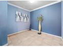 Empty spare room with light blue walls and tile floors at 3570 Southern Cross Loop, Kissimmee, FL 34744