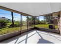 Spacious screened porch overlooking the backyard at 825 Kottle S Cir, Daytona Beach, FL 32114