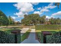 Landscaped walkway leading to the house with a view of a lake at 450 Cherokee Dr, Orlando, FL 32801