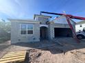 Image of a single-story home construction showcasing cinder block walls and garage with open entry at 5268 Prairie Preserve Run, St Cloud, FL 34772