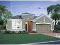 Charming single-story home with manicured lawn, complemented by lush landscaping and a spacious two-car garage at 5268 Prairie Preserve Run, St Cloud, FL 34772