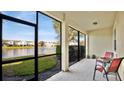 Relaxing screened patio overlooking a peaceful lake at 564 Woodland Terrace Blvd, Orlando, FL 32828