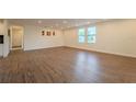 Open living room with hardwood floors, recessed lighting, and plenty of natural light at 1235 19Th St, Orlando, FL 32805