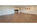 Large living area with hardwood floors, recessed lighting, and access to the kitchen at 1235 19Th St, Orlando, FL 32805
