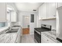 Renovated kitchen, featuring modern appliances and granite countertops at 811 Briercliff Dr, Orlando, FL 32806