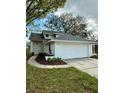 Charming single-Gathering home with a well-maintained front yard and two car garage at 10632 Whitestone Ct, Orlando, FL 32817