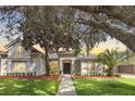 Attractive home at sunset with lush landscaping at 1610 Conway Isle Cir, Belle Isle, FL 32809